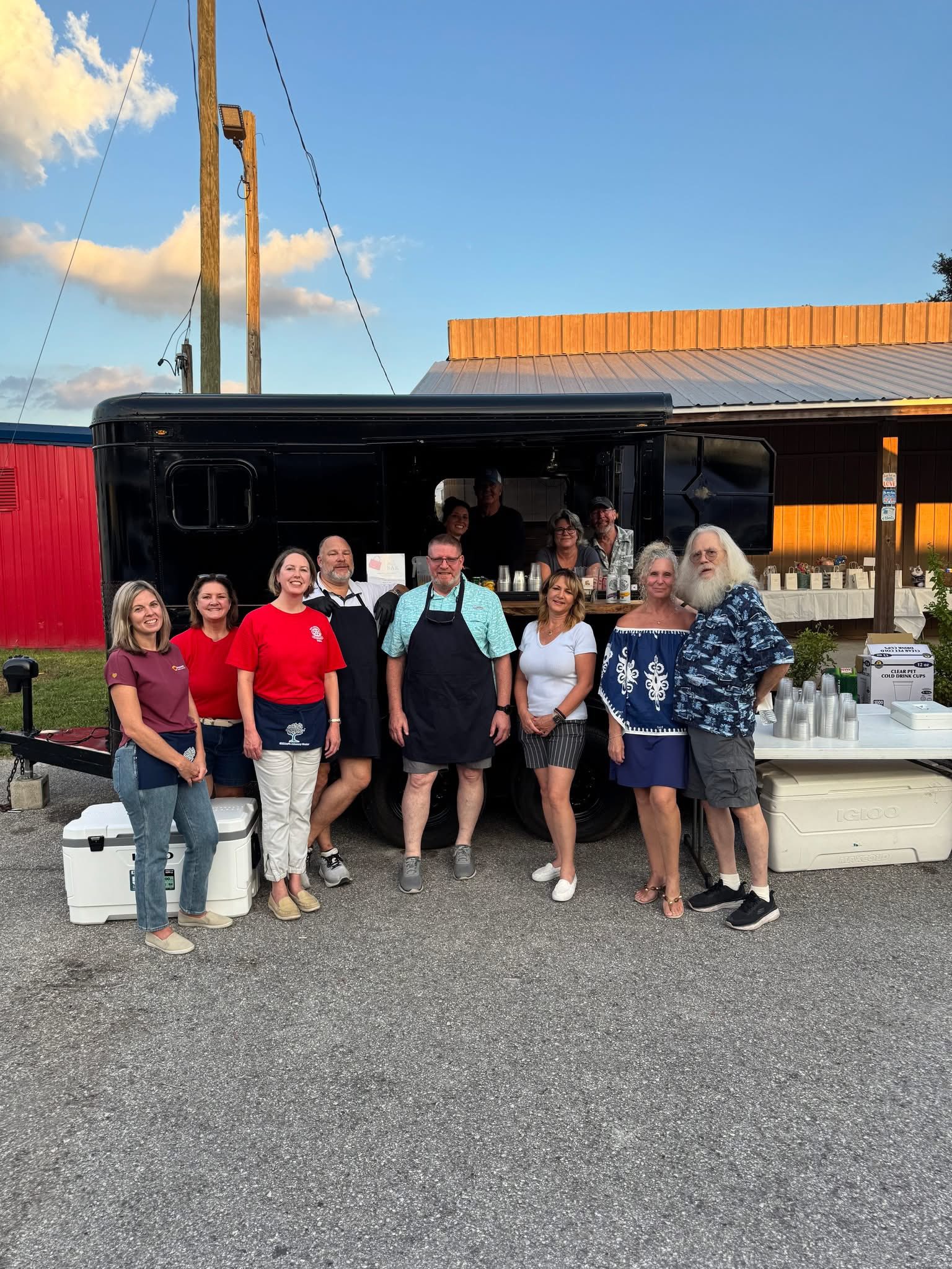 Happy group of guests and the BSB team outside the trailer bar