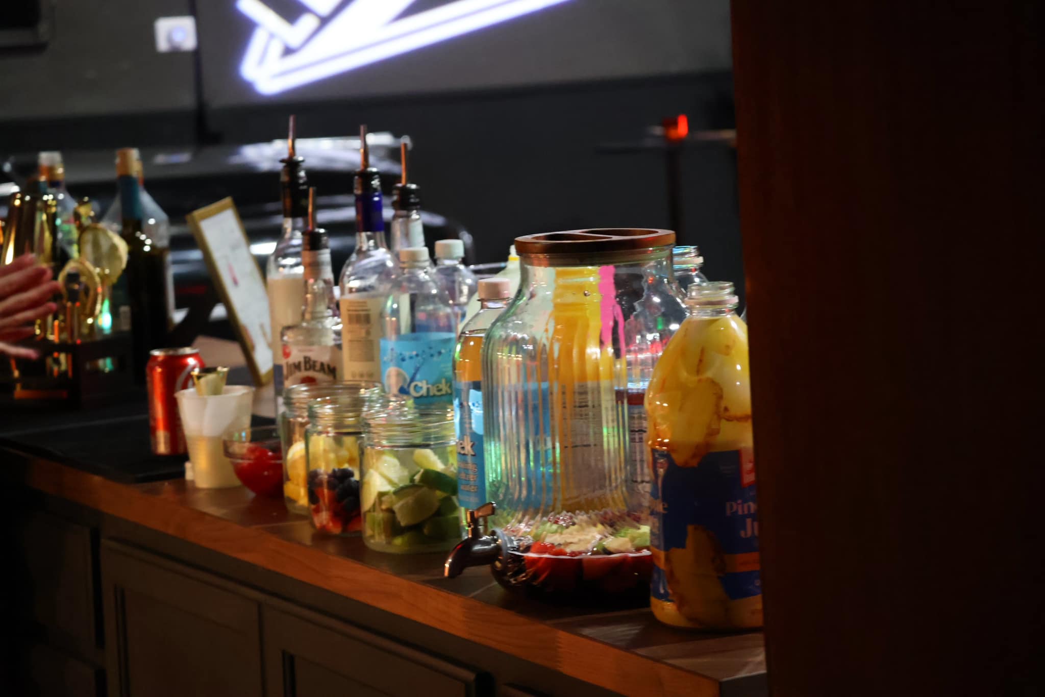 Colorful garnishes and fresh mixer ingredients on the bar
