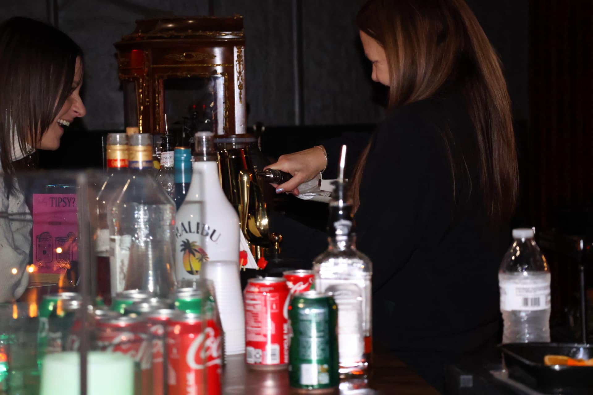 Bartender serving drinks at a nighttime event