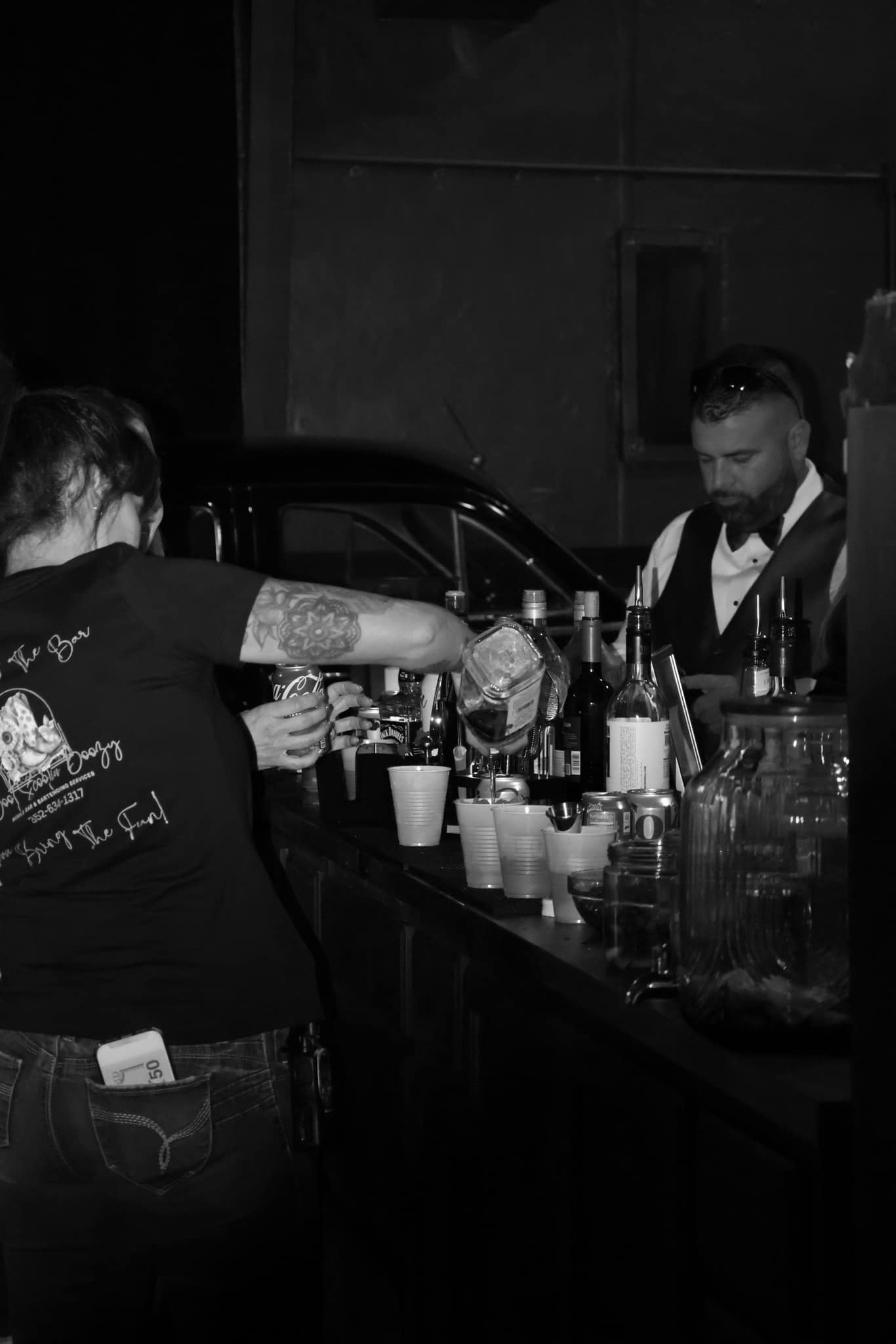 Professional bartender crafting cocktails at a private event