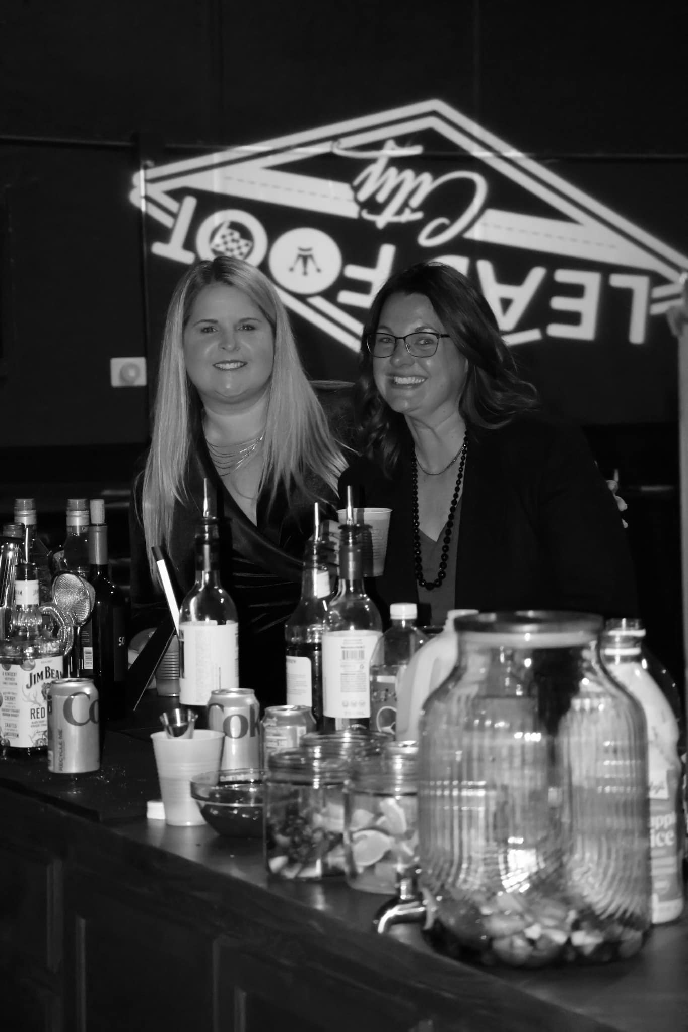 Kristin and Nicole serving at the Lead Foot City event